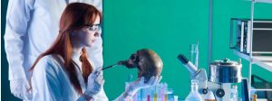 young forensic scientist brushes skull