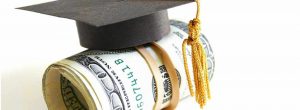 money roll underneath a graduation cap